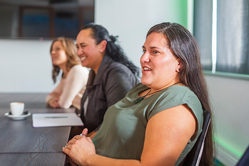 a group of women leaders in a meeting