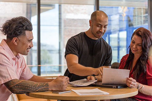 Three people in a business meeting using te reo māori